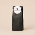Kleine schwarze 100 Gramm Kaffeetüte mit dem Marrone Blu Logo 